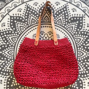 Red handmade crocheted handbag in raffia